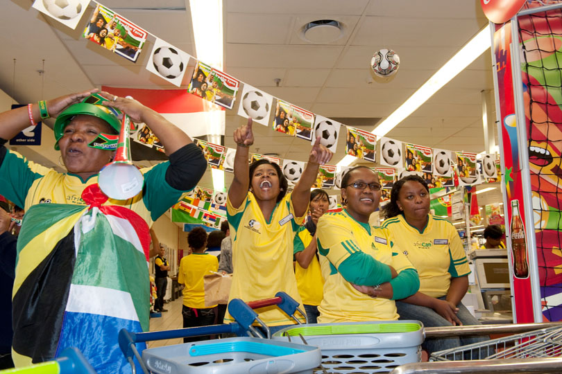 Supermarket employees watch “Bafana Bafana” <p>the South African National team on TV