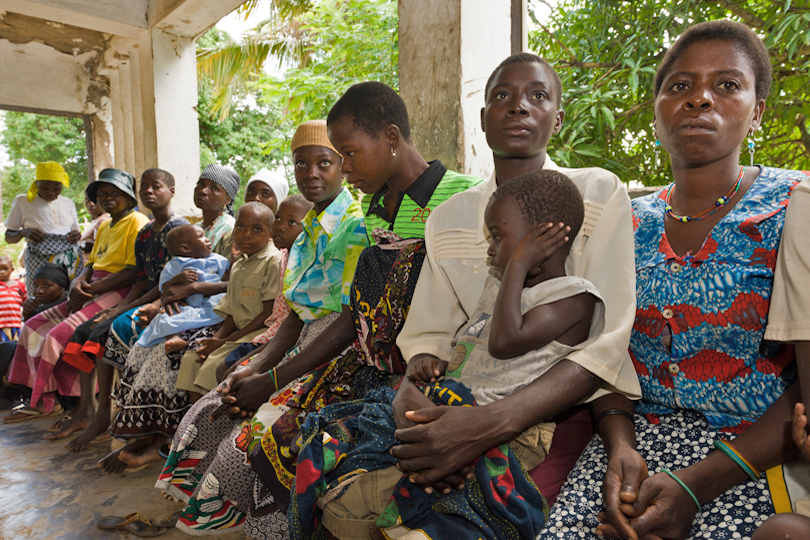 HIV/AIDS clinic mothers with children waiting<p> outside a dispensary