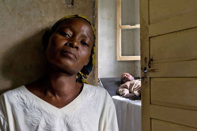 Woman waiting for her sick husband to have a medical check <p>in a dispensary, Quelimane, Mozambique