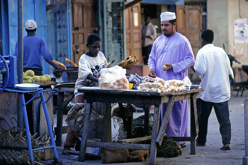 A boy sells refreshing sugarcane juice <p>in the streets of Stone Town
